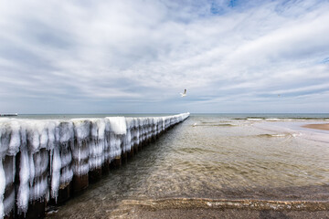 Ice covered groynes at the Baltic Sea in the north of Germany