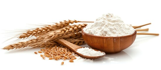 A wooden bowl filled with rice sits beside a wooden spoon on a flat surface. The grains of rice are...