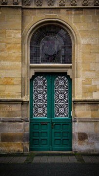 Green beautiful door in Munster, Germany. External wooden glass door. High quality photo