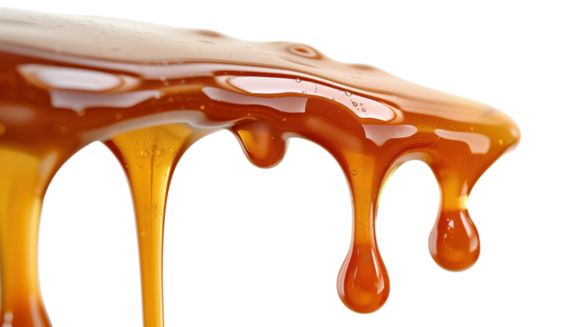 Glistening caramel sauce dripping from edge isolated on transparent background