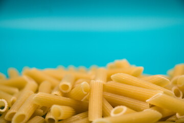 Pasta isolated on blue background with copy space