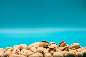 Pistachios isolated on blue background
