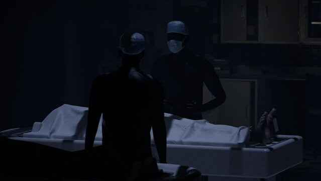 Two doctors standing in fron of a corpse in the morgue and ready to execute an autopsy