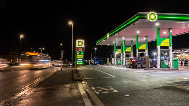 A BP petrol station forecourt with passing traffic. Stourbridge, UK - February 20, 2024