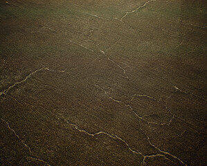 Worn out and cracked old asphalt. Detail shot. - 743154269