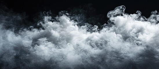 A black and white composition capturing clouds of white smoke billowing against a velvety black background. The contrast between the colors creates a mesmerizing and dynamic visual experience.