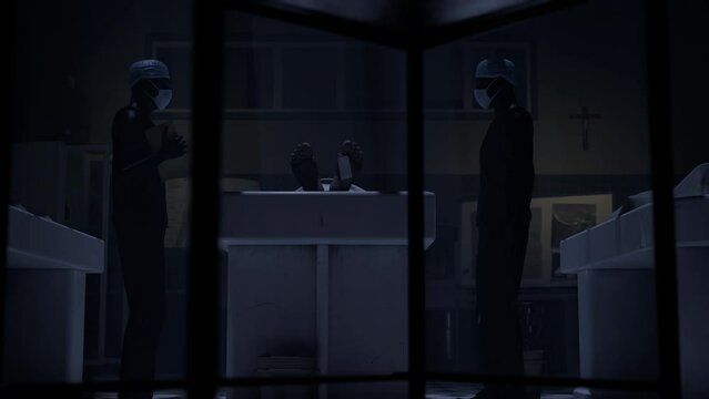 Two doctors standing in fron of a corpse in the morgue and ready to execute an autopsy