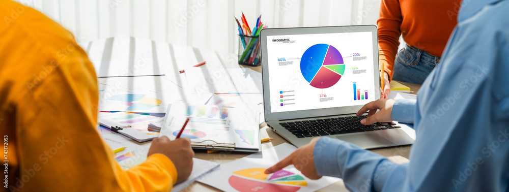 Poster startup company employee working together using laptop analyzing bi dashboard paper on financial dat