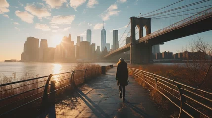 Poster Verenigde Staten a person walking on a walkway with a bridge and a city in the background