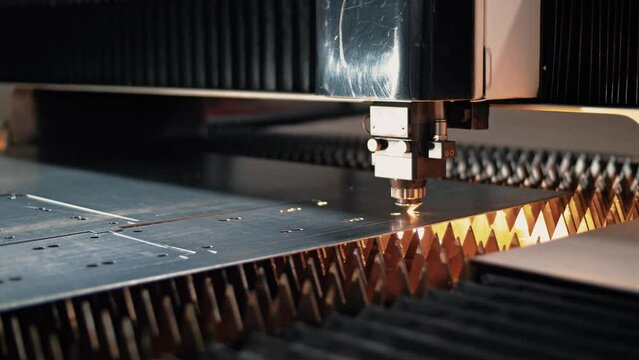 The CNC thin sheet laser cutting machine cuts steel sheet by means of plasma. Close-up  