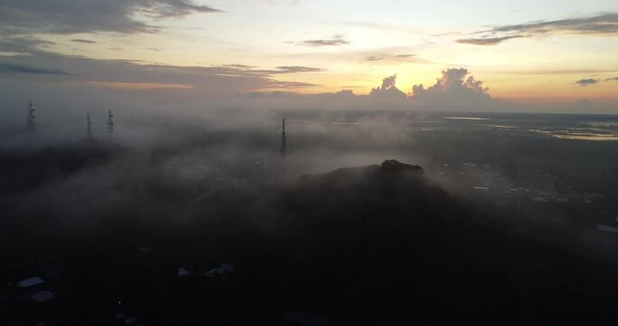 Sunrise in the mountains. View from above of Sengkang City in the morning, South Sulawesi, Indonesia. Fog and morning sun