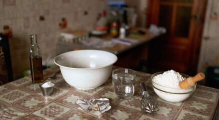 Kitchen background with ingredients for making pizza or bread dough