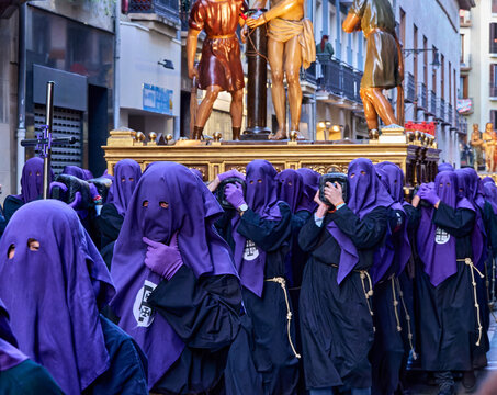 Solemn Procession Scene with Individuals in Purple Robes