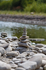 Amazing round stone near a flowing river, Stones are perfectly balanced on one another and forming, These are river stones, or also buddha stones