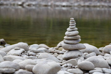 Amazing round stone near a flowing river, Stones are perfectly balanced on one another and forming, These are river stones, or also buddha stones