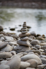 Amazing round stone near a flowing river, Stones are perfectly balanced on one another and forming, These are river stones, or also buddha stones