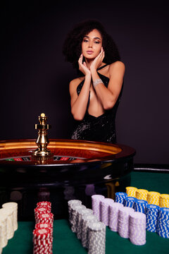 Photo of chic attractive lady spend friday night in royal las vegas poker club wait for lucky number in roulette