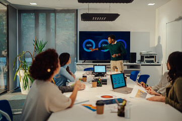 African american man team leader presenting project to its diverse colleagues