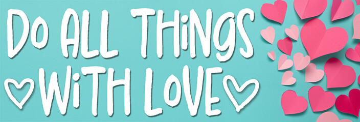 Do all things with love saying with pink paper hearts made of construction paper on aqua blue background
