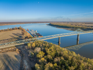 bridge and barges on the Mississippi  River at confluence with the Ohio River below Cairo, IL,...