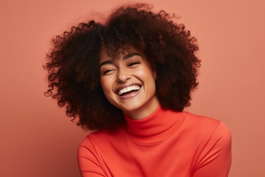 Portrait of happy african american woman with Afro hairstyle in red sweater