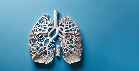Paper decorative model of lungs on a blue background. World tuberculosis day, pneumonia, respiratory disease concept. Top view, flat lay. Space for text