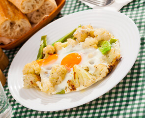 Appetizing cauliflower fried eggs for breakfast