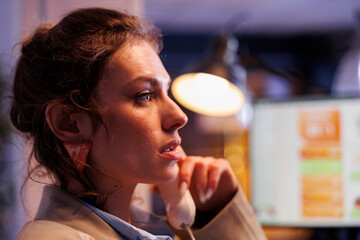 Businesswoman analyzing financial growth report in startup office, talking at landline phone with remote coworker. Executive manager planning financial investment strategy to increase business profit