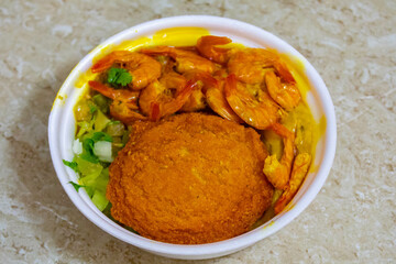 Brazilian acarajé traditional food of African origin in Bahia with vatapá caruru and dried shrimp