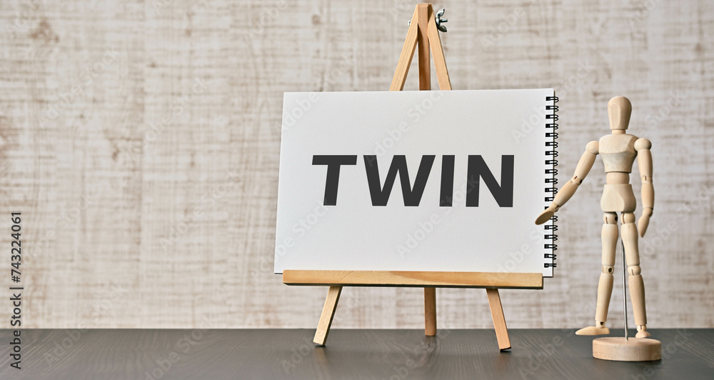 Poster there is notebook with the word twin. it is as an eye-catching image.