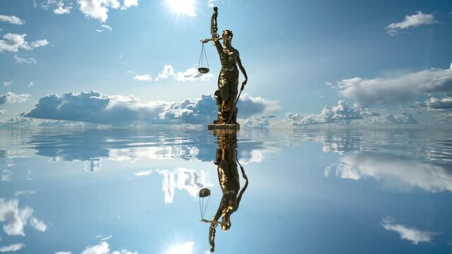 the statue of justice turns against the backdrop of clouds moving across the blue sky. time lapse 4k.