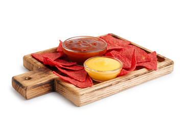 Wooden board with tasty red nachos with sauces on white background