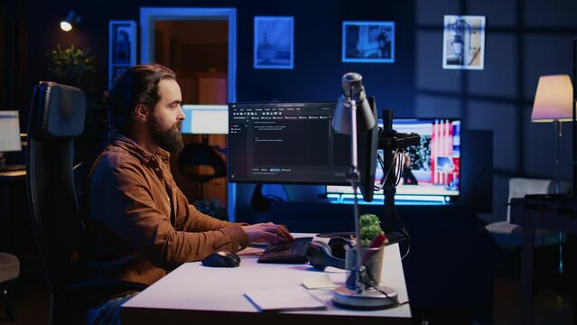 Programmer developing code on computer screen while in personal office using java programming languages. IT admin working with software tool, fixing database errors while working from home, camera B