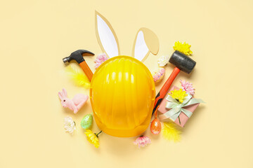 Composition with constructor's tools, gift box and Easter decor on color background