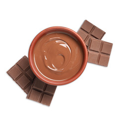 Tasty milk chocolate paste in bowl and pieces isolated on white, top view