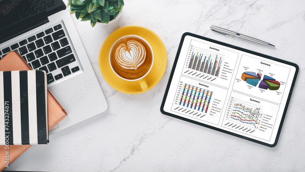 Poster a laptop and digital tablet showing financial data graphs, paired with a latte and notebook, on a ma