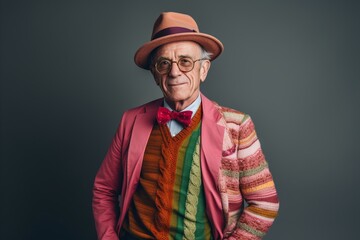 Portrait of an old man in a hat and a colorful jacket.