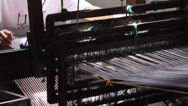 Traditional loom machines where all processes are carried out using human power.