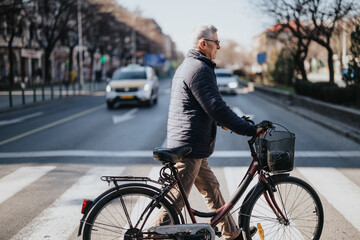 Mature adult male in casual attire cycling down a city road, promoting sustainable transportation and an active lifestyle.