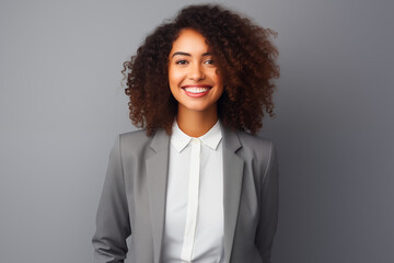 business black woman adjusting her clothes on a grey background - Powered by Adobe