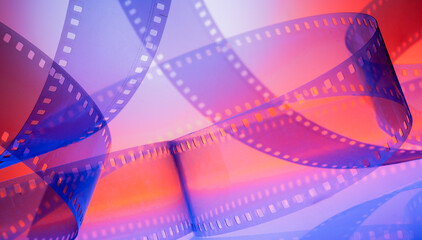 multicolored cinematic background with film strip - obrazy, fototapety, plakaty