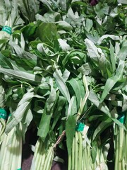 Tapioca leaves that have been tied up are sold in supermarkets, even though they have withered...