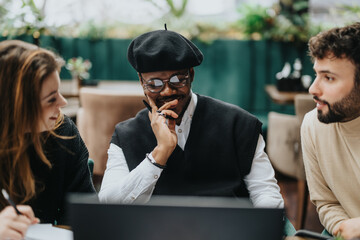 Multiethnic business colleagues in a casual meeting at a restaurant, deeply engaged in discussion with a focus on collaboration and strategy.