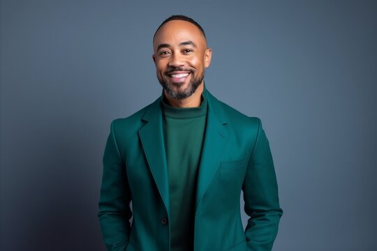 Portrait of a handsome african american man in a green suit.