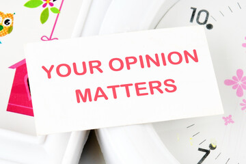 YOUR OPINION MATTERS phrase written on a white card