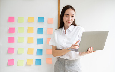 Asian businesswoman calculate financial graphs showing results about their investments, planning a...