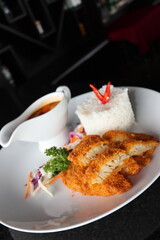 delicious japanese food dori fish katsu with curry and rice on a white plate