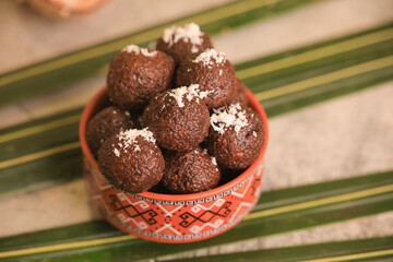 coconut balls, chocolate balls closeup with selective focus and blur