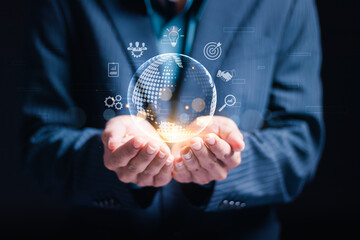 Analyzes big data concept, data exchange, digital marketing, financial and investment. Businessman holding virtual globe and marketing strategy icons on global business connection.