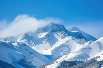 Fotobehang view of a snowy mountain peak with a blue sky © Formoney